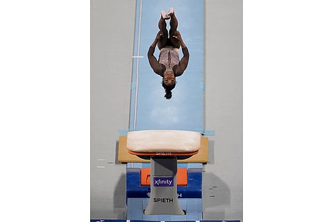 Simone Biles competes on the vault